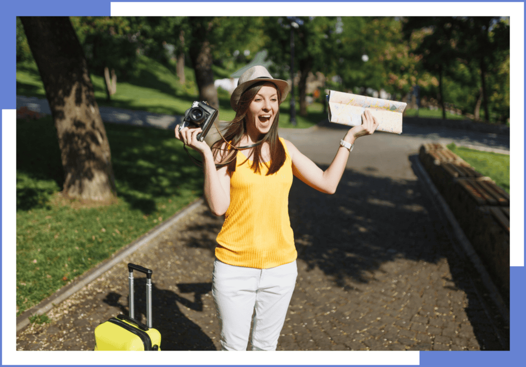 A lady in yellow mesmerized by the view in front of her.