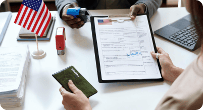 A man handing an approved visa application form to a woman.
