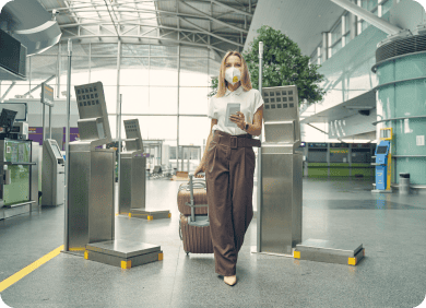 woman walking through the airport with her eVisa to Cuba