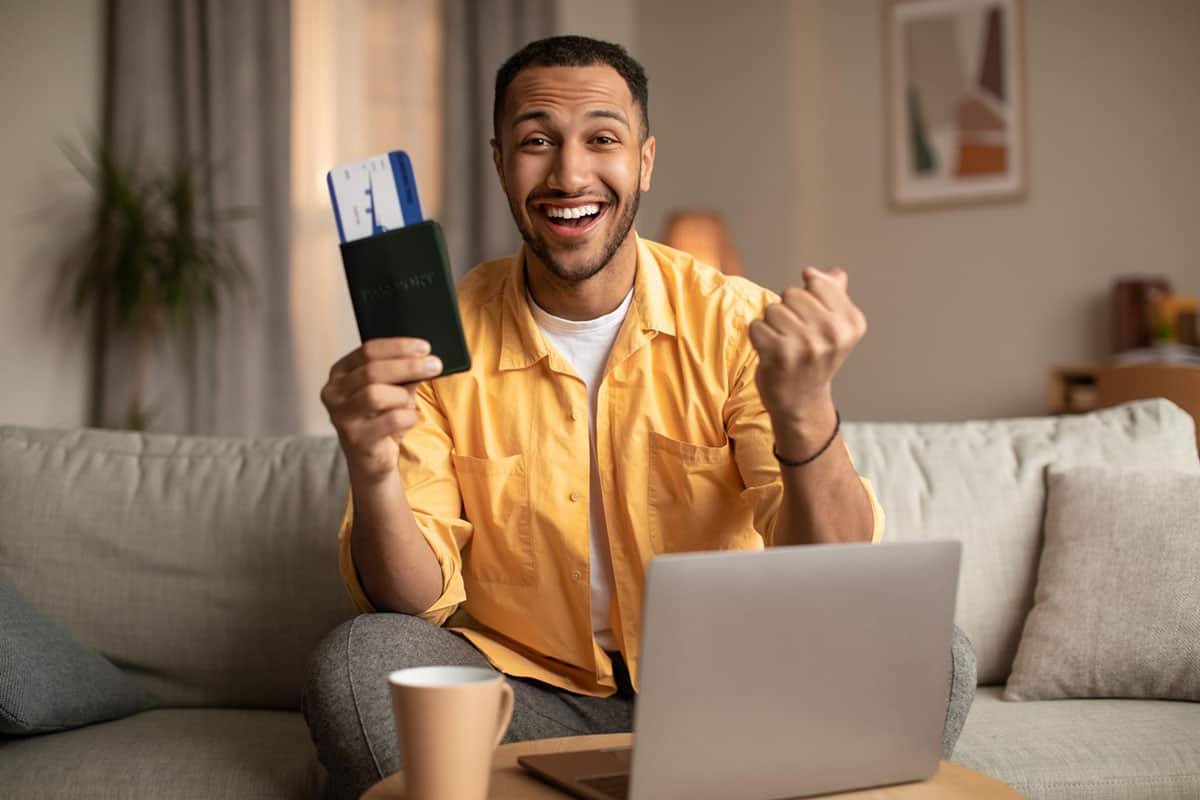 man on a couch getting his cuban visa online