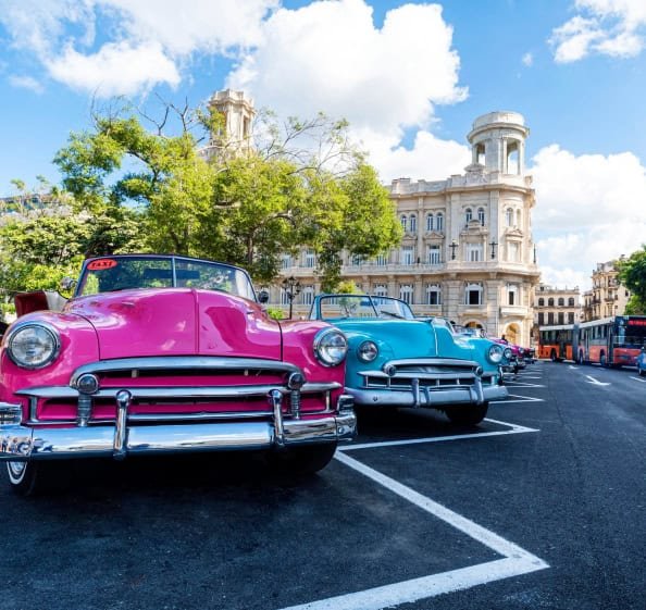 very colorful old chevys in Cuba